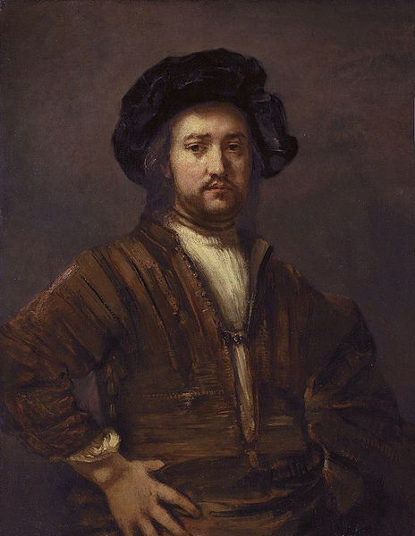 Portrait of a man with arms akimbo